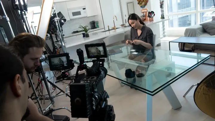 Professional video production crew filming on location